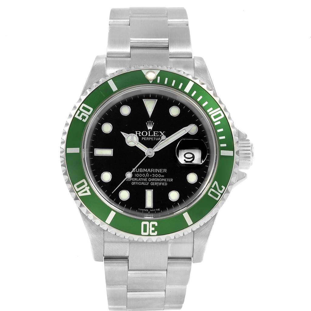 The image shows a frontal view of a Rolex Submariner 16610LV Men
s Stainless Steel Black Dial 16610LV Men
s Stainless Steel Black Dial watch with a green bezel and stainless steel bracelet.