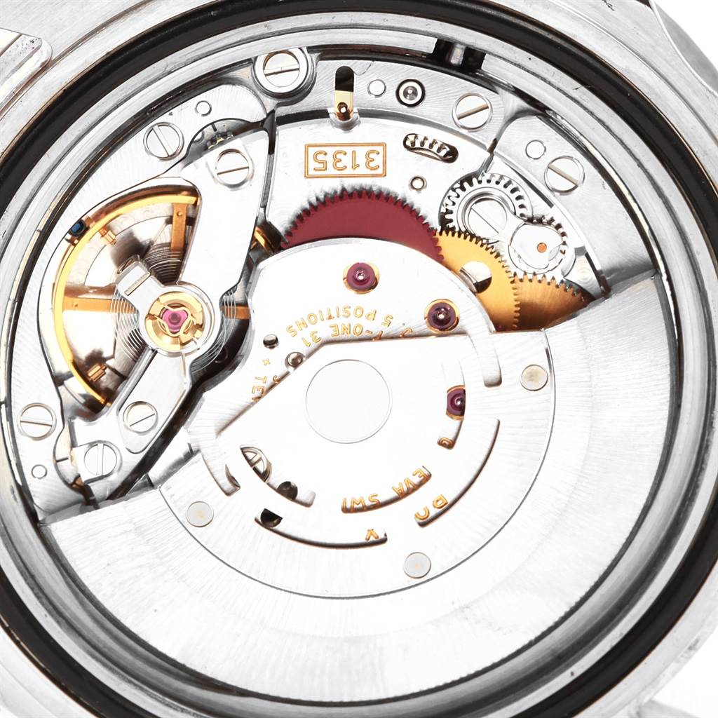 This image shows the intricate internal mechanics of a Rolex Submariner 16610LV Men
s Stainless Steel Black Dial 16610LV Men
s Stainless Steel Black Dial watch, viewed from the back.