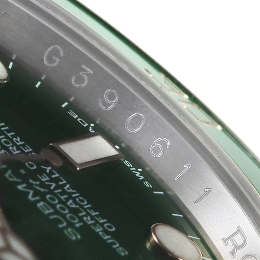 This image shows a close-up angle of the bezel and chapter ring of the Rolex Submariner 116610LV Men
s Stainless Steel Green Dial 116610LV Men
s Stainless Steel Green Dial.