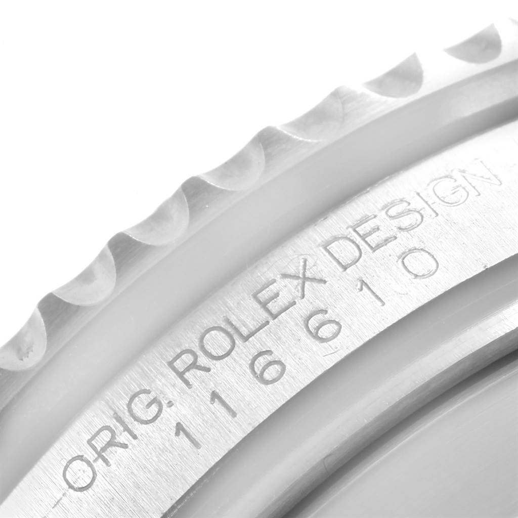 This close-up image shows the reference number engraving and part of the bezel on a Rolex Submariner 116610LV Men
s Stainless Steel Green Dial 116610LV Men
s Stainless Steel Green Dial.