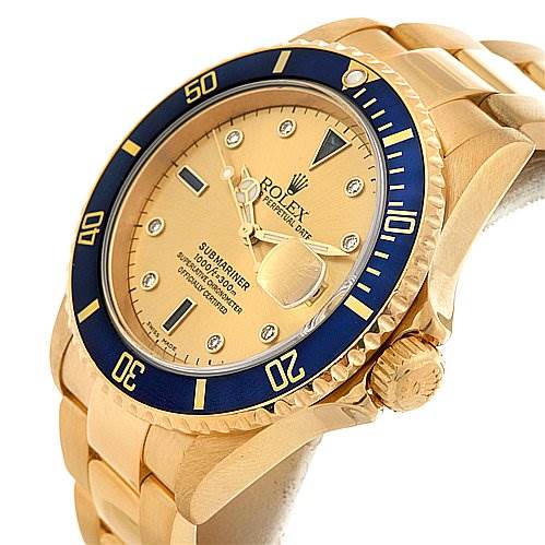 The image shows a Rolex Submariner 16618 Men's Yellow Gold Champagne Dial 16618 Men's Yellow Gold Champagne Dial watch at a three-quarter angle highlighting the face, bezel, crown, and part of the bracelet.