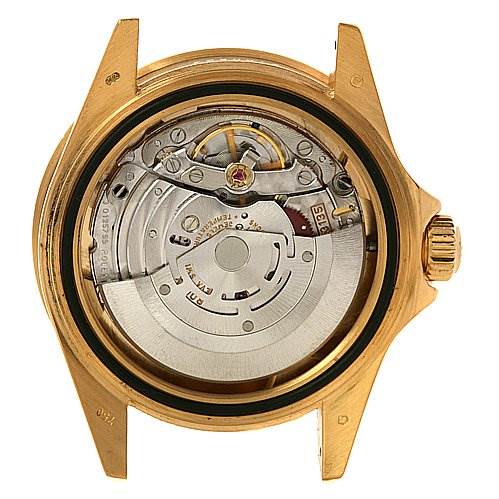 This image shows the back view of a Rolex Submariner 16618 Men's Yellow Gold Champagne Dial 16618 Men's Yellow Gold Champagne Dial watch, highlighting its internal mechanical movement.