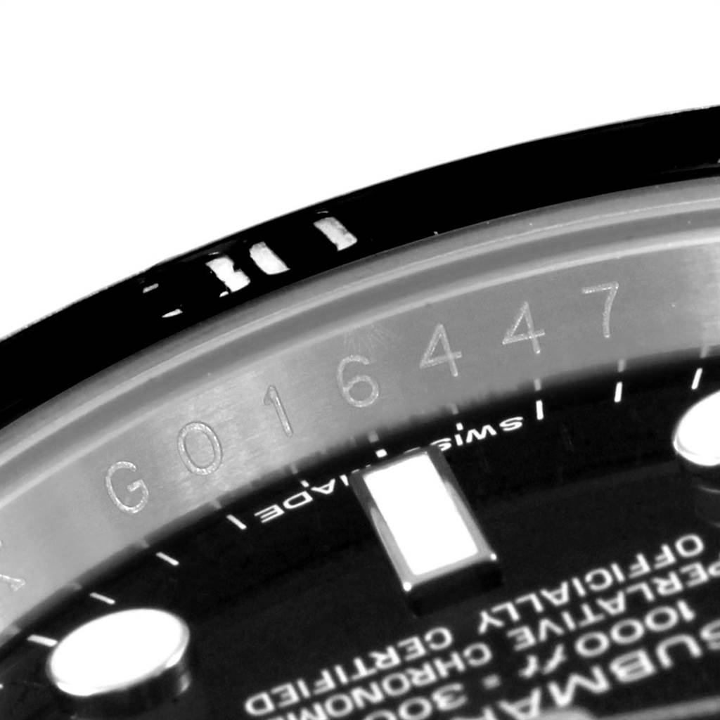 The image shows a close-up of the dial and inner bezel of a Rolex Submariner 116610 Men's Stainless Steel Black Dial 116610 Men's Stainless Steel Black Dial, highlighting its serial number.