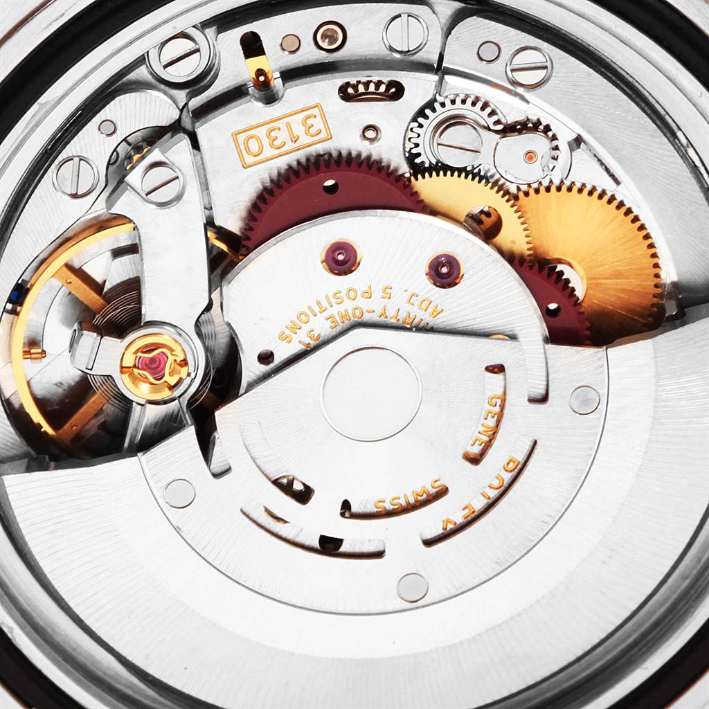 This image shows the intricate internal mechanism of a Rolex Submariner 14060 Men's Stainless Steel Black Dial 14060 Men's Stainless Steel Black Dial watch at a close-up angle.