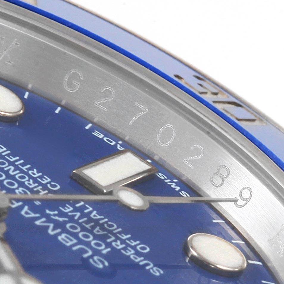 The image shows a close-up angle of the Rolex Submariner 116619BLSO Men's White Gold Blue Dial 116619BLSO Men's White Gold Blue Dial's blue dial with part of the serial number on the rehaut.