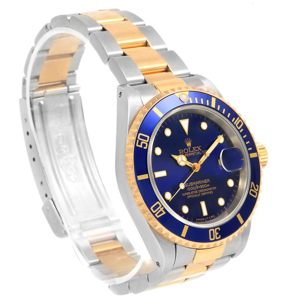 The image shows a Rolex Submariner 16613 Men's Steel and Gold (two tone) Blue Dial 16613 Men's Steel and Gold (two tone) Blue Dial watch at an angle highlighting the face, bezel, crown, and two-tone bracelet.