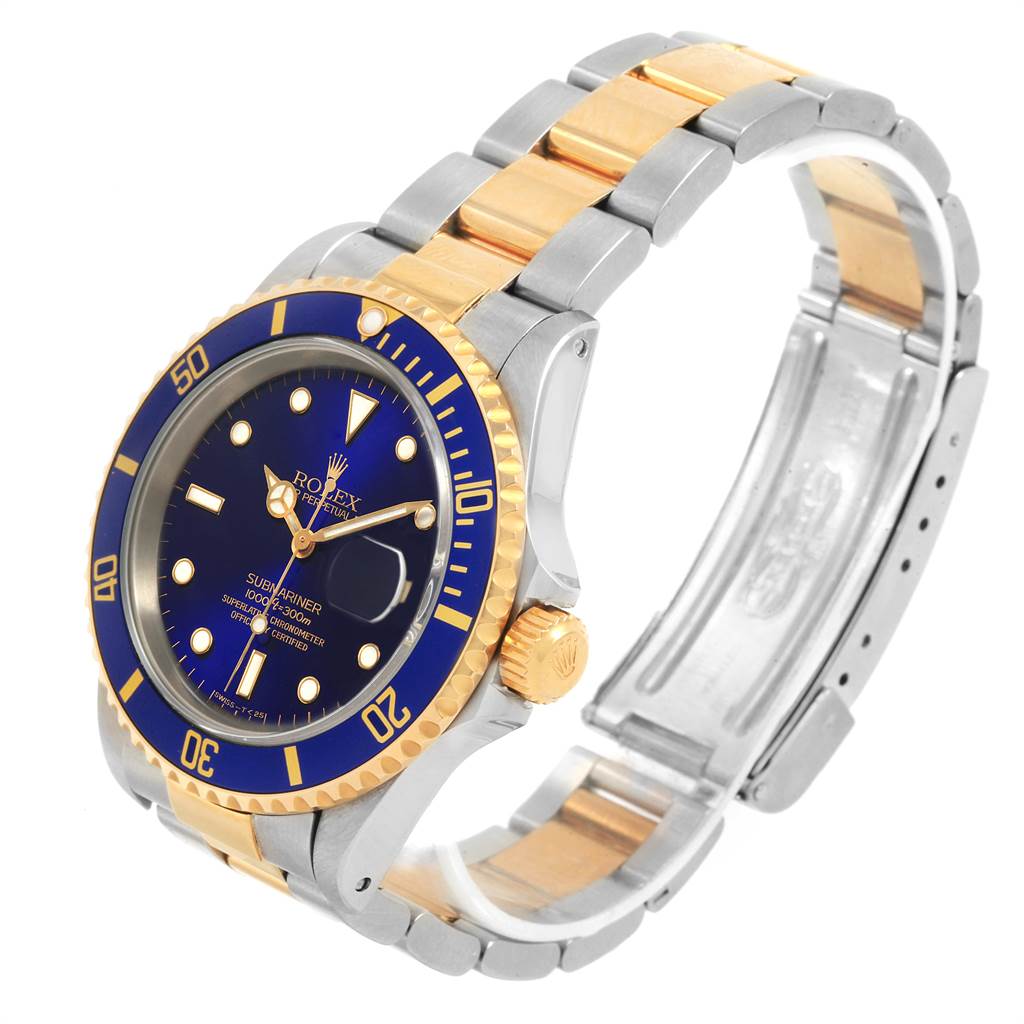 The image shows a Rolex Submariner 16613 Men's Steel and Gold (two tone) Blue Dial 16613 Men's Steel and Gold (two tone) Blue Dial watch at a three-quarter angle, highlighting its gold and stainless steel bracelet and blue dial.