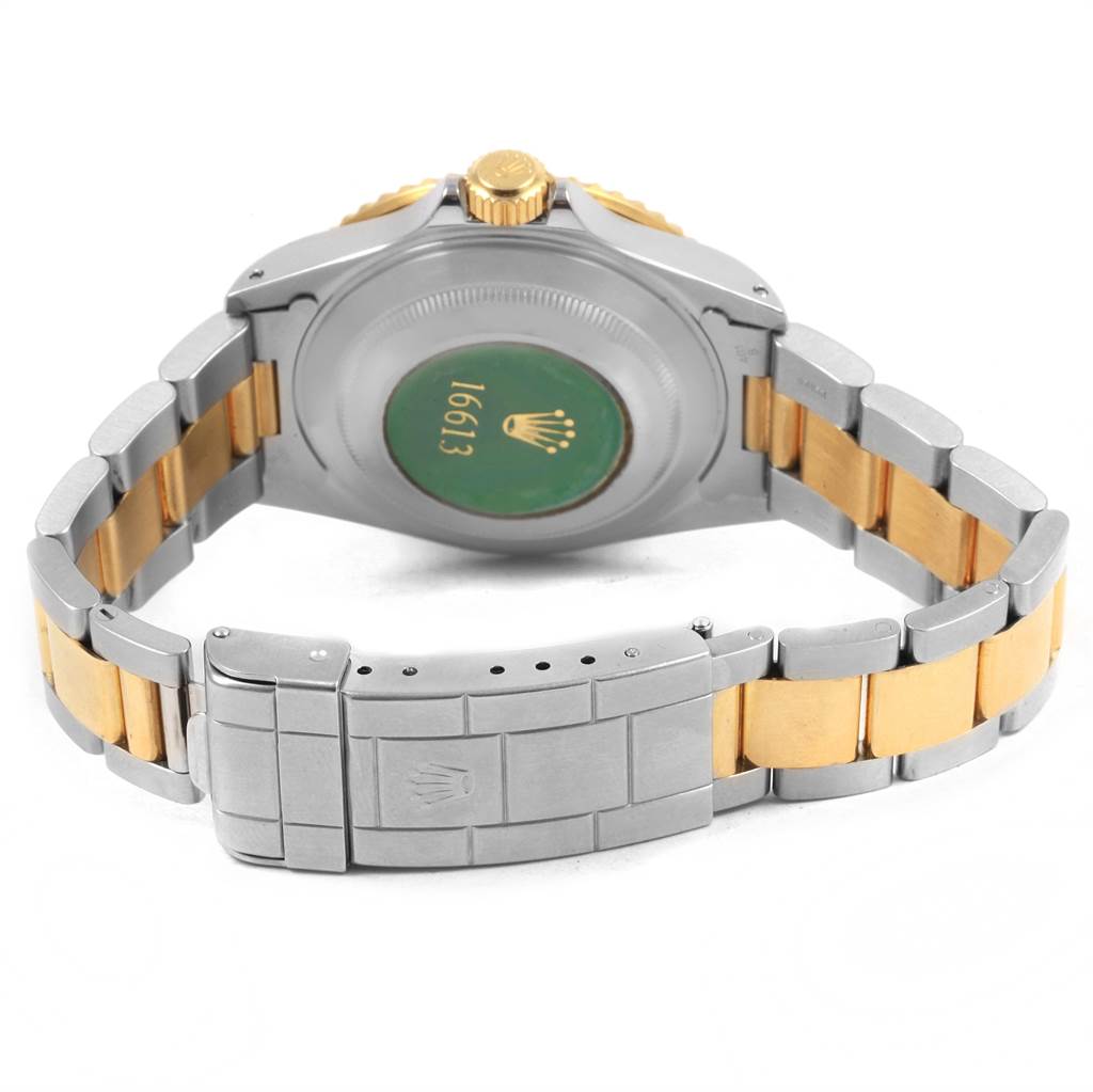 The image shows the back and bracelet of a Rolex Submariner 16613 Men's Steel and Gold (two tone) Blue Dial 16613 Men's Steel and Gold (two tone) Blue Dial watch, highlighting the clasp, crown, and case back.