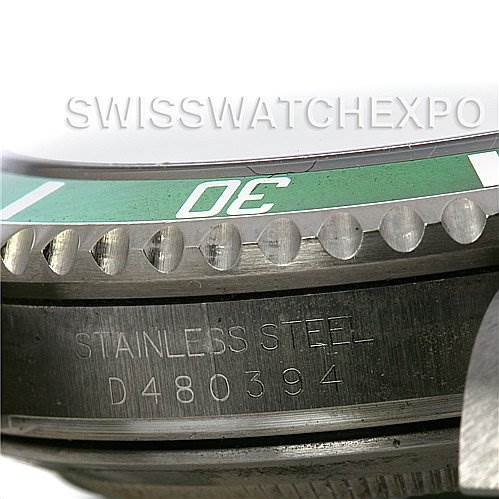 This image shows a close-up of the bezel and case side of a Rolex Submariner 16610V Men's Stainless Steel Black Dial 16610V Men's Stainless Steel Black Dial watch, including the stainless steel marking and serial number.