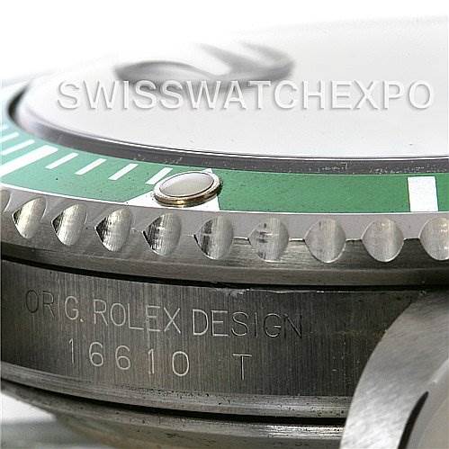Close-up of a Rolex Submariner 16610V Men's Stainless Steel Black Dial 16610V Men's Stainless Steel Black Dial watch showing the side of the case with model number 16610 T and parts of the bezel.