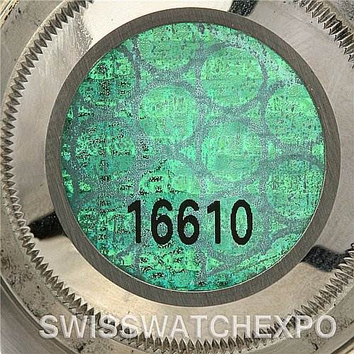 This image shows the case back of a Rolex Submariner 16610V Men's Stainless Steel Black Dial 16610V Men's Stainless Steel Black Dial 16610 with a holographic sticker.
