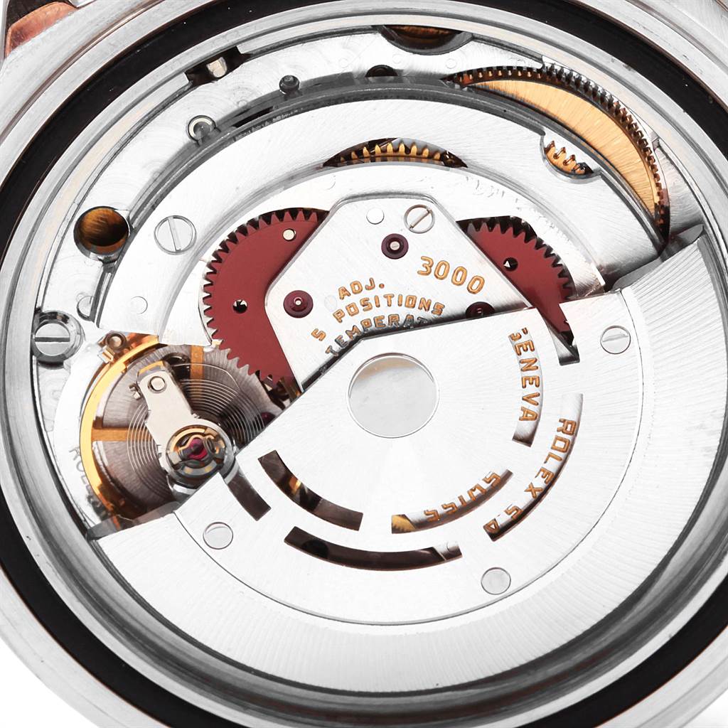 This close-up image shows the intricate movement and internal mechanisms of the Rolex Submariner 14060 Men's Stainless Steel Black Dial 14060 Men's Stainless Steel Black Dial watch.