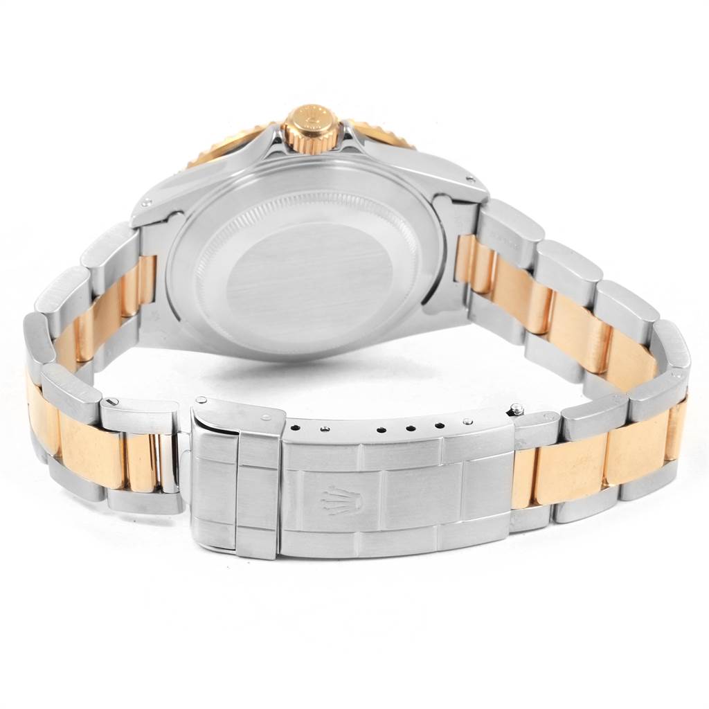 This image shows the back view of a Rolex Submariner 16613 Men's Steel and Gold (two tone) Blue Dial 16613 Men's Steel and Gold (two tone) Blue Dial watch, including the case back, crown, and dual-tone bracelet with the clasp.