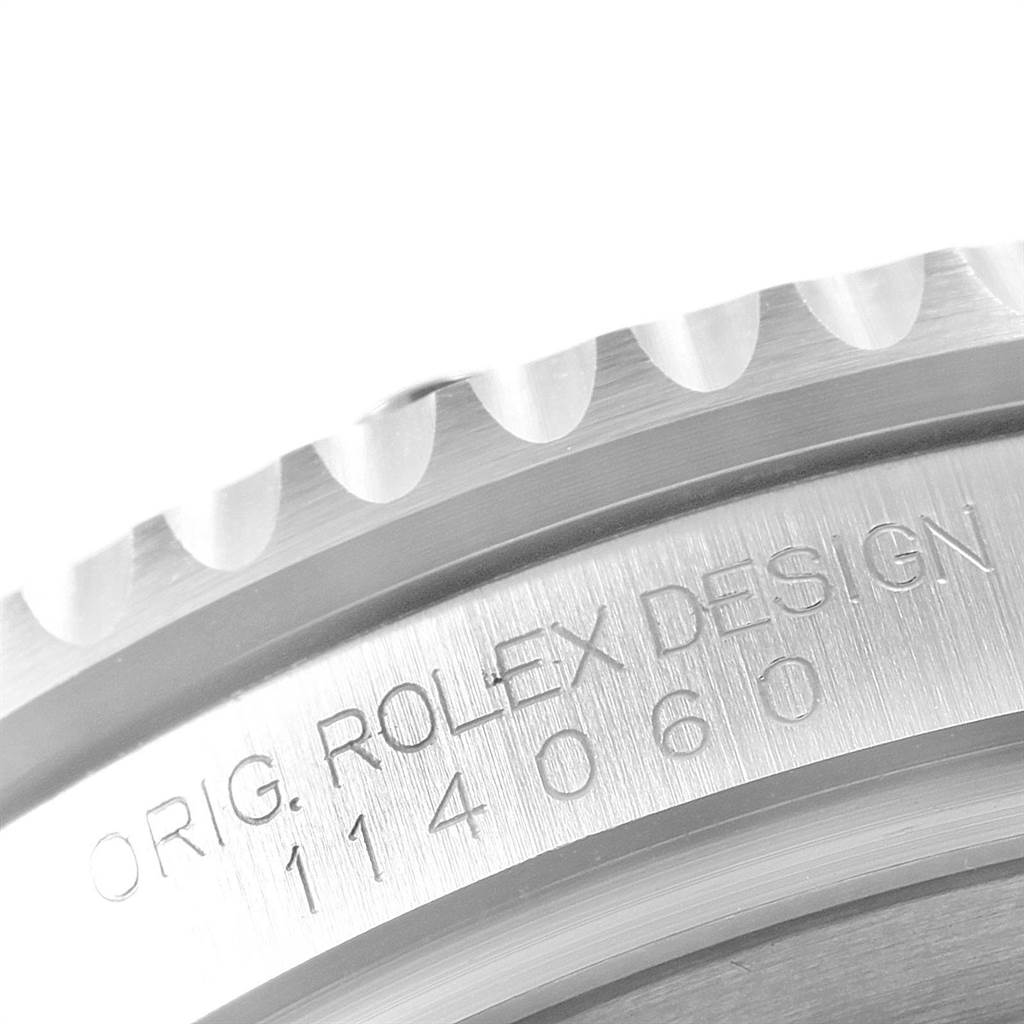 The image shows a close-up view of the side case and engraved text of a Rolex Submariner 114060 Men's Stainless Steel Black Dial 114060 Men's Stainless Steel Black Dial.