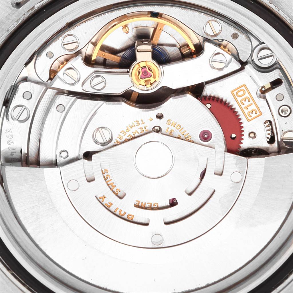 This close-up view shows the intricate movement and internal mechanism of the Rolex Submariner 114060 Men's Stainless Steel Black Dial 114060 Men's Stainless Steel Black Dial watch.