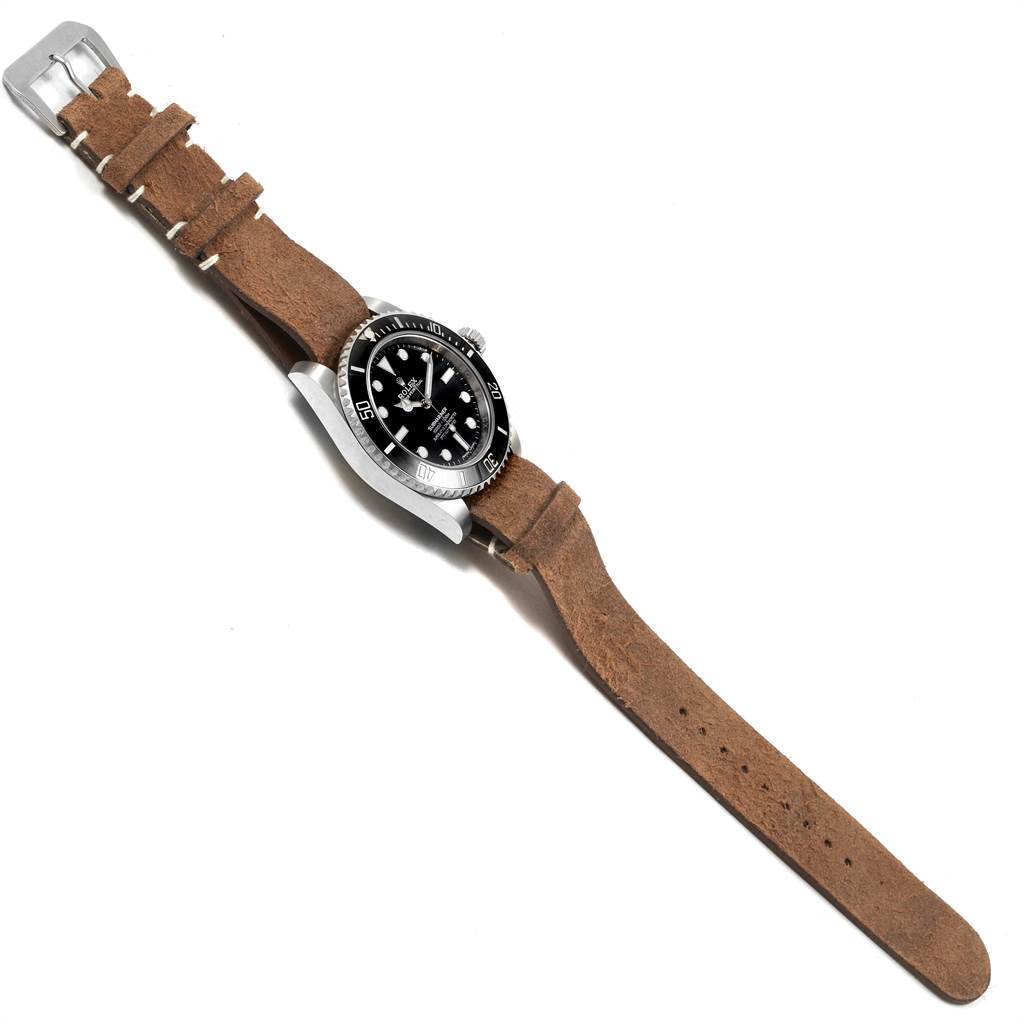 The image shows a Rolex Submariner 114060 Men's Stainless Steel Black Dial 114060 Men's Stainless Steel Black Dial watch at an angled top-down view, displaying the face, crown, and leather strap.