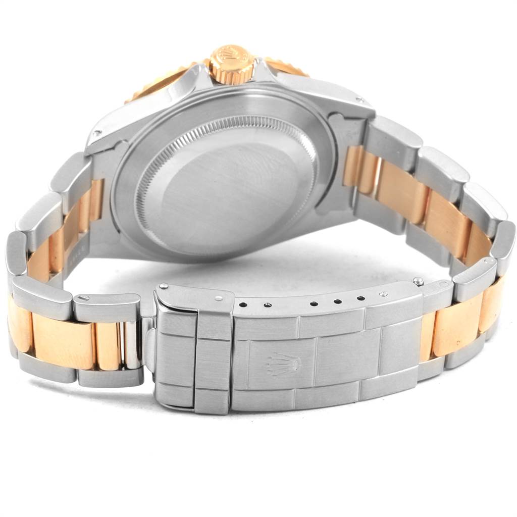 This image shows the back case and bracelet clasp of a Rolex Submariner 16613 Men's Steel and Gold (two tone) Black Dial 16613 Men's Steel and Gold (two tone) Black Dial watch.