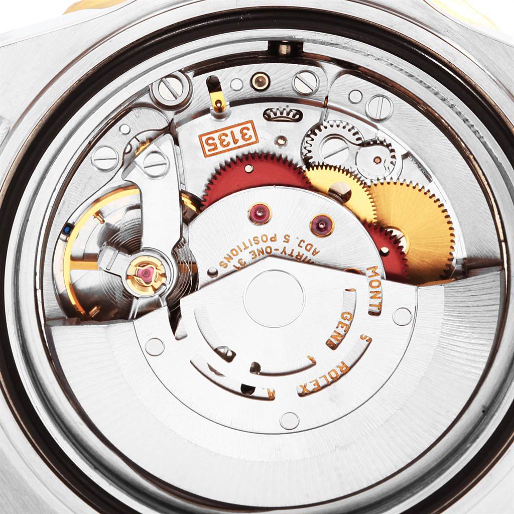 This image shows the back case of a Rolex Submariner 16613 Men's Steel and Gold (two tone) Black Dial 16613 Men's Steel and Gold (two tone) Black Dial, revealing the intricate details of its inner mechanical movement.