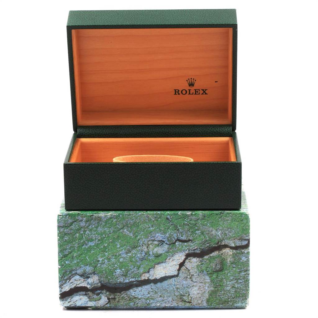 The image shows an empty green Rolex Submariner 16613 Men's Steel and Gold (two tone) Black Dial 16613 Men's Steel and Gold (two tone) Black Dial watch box with an open lid, revealing the wooden interior and beige watch holder.