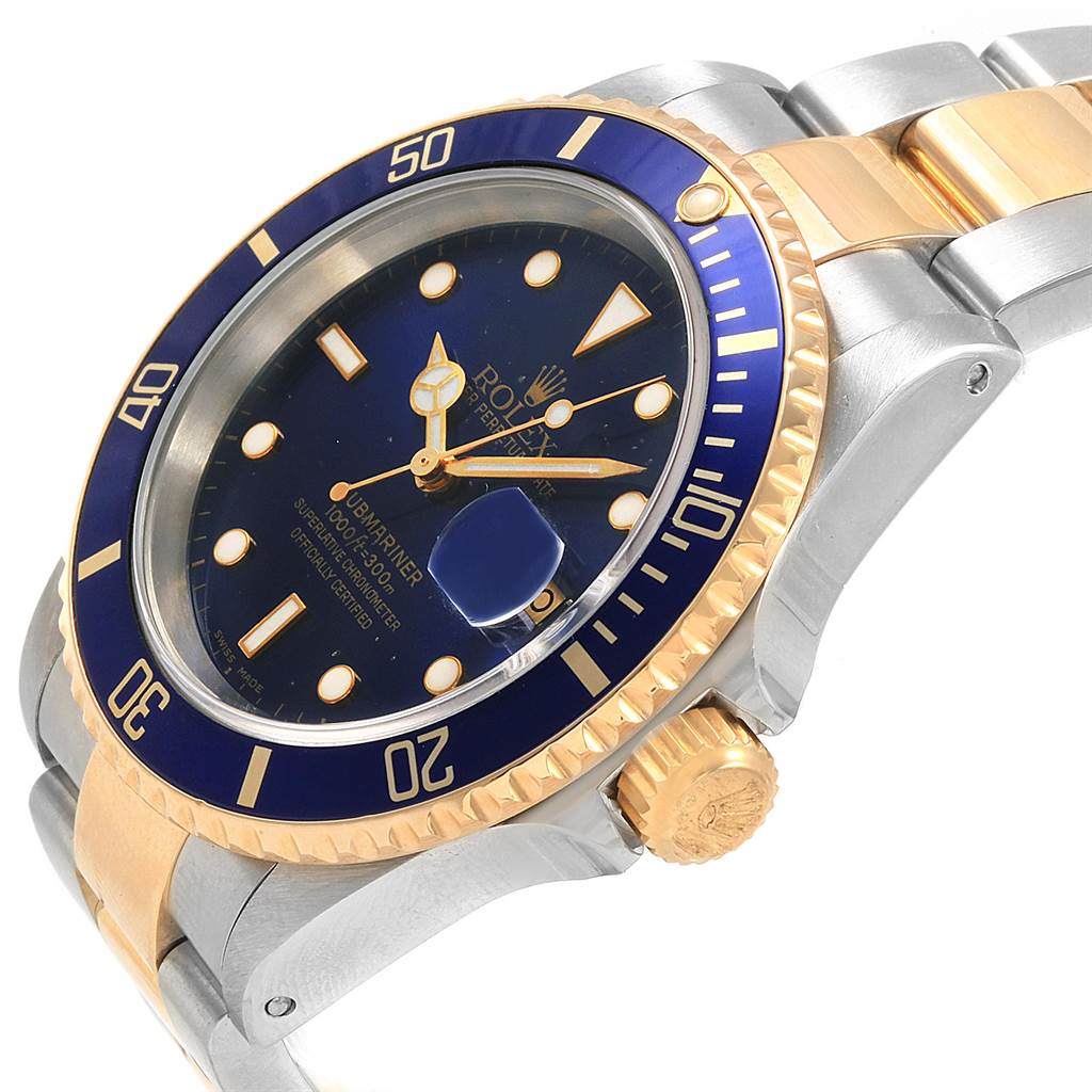 The image shows a close-up angle of the Rolex Submariner 16613 Men's Steel and Gold (two tone) Blue Dial 16613 Men's Steel and Gold (two tone) Blue Dial watch face and part of the bracelet.