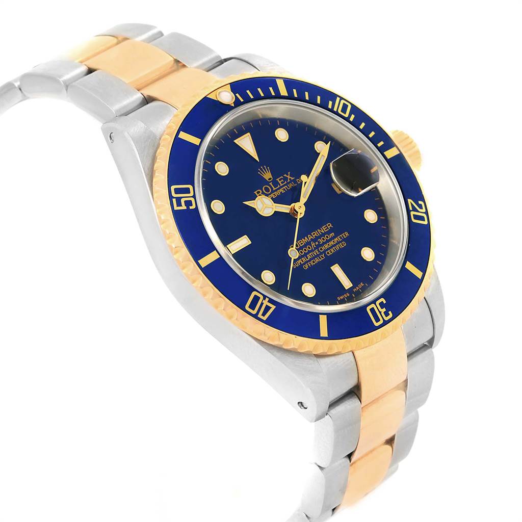 This image shows a Rolex Submariner 16613 Men's Steel and Gold (two tone) Blue Dial 16613 Men's Steel and Gold (two tone) Blue Dial watch angled from the left side, showcasing its blue dial, bezel, and two-tone metal bracelet.