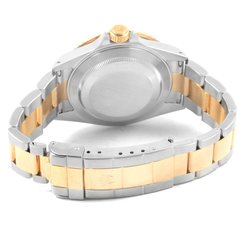 The image shows the backside of the Rolex Submariner 16613 Men's Steel and Gold (two tone) Blue Dial 16613 Men's Steel and Gold (two tone) Blue Dial, featuring the case back, crown, and two-tone bracelet.