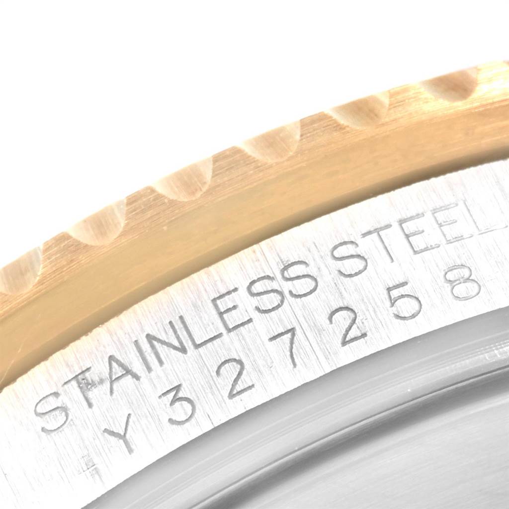 This image shows a close-up angle of the bezel and case back of the Rolex Submariner 16613 Men's Steel and Gold (two tone) Blue Dial 16613 Men's Steel and Gold (two tone) Blue Dial, highlighting the "STAINLESS STEEL" inscription.