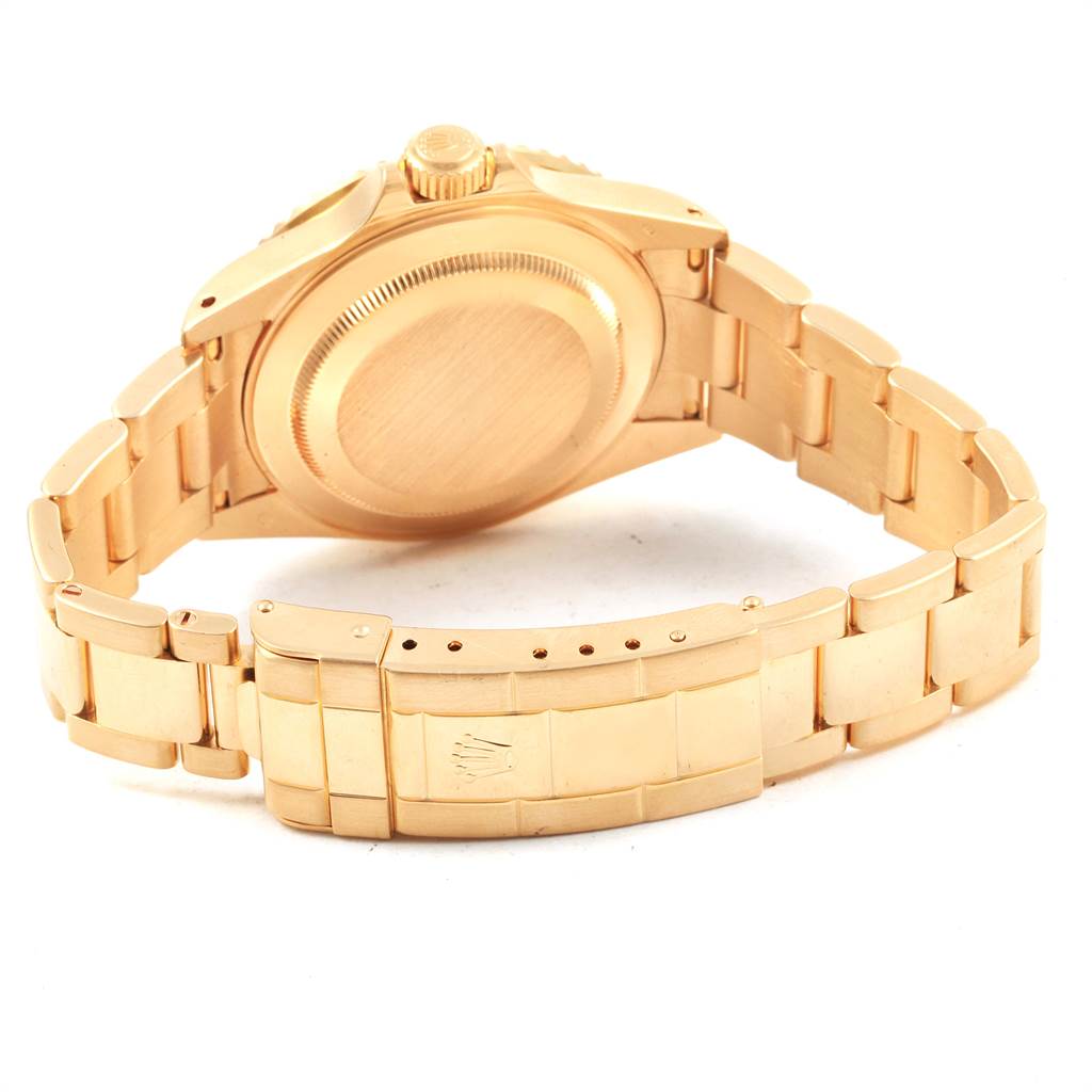 This image shows the back view and bracelet of a gold Rolex Submariner 16618 Men's Yellow Gold Blue Dial 16618 Men's Yellow Gold Blue Dial watch, displaying the case back and clasp.