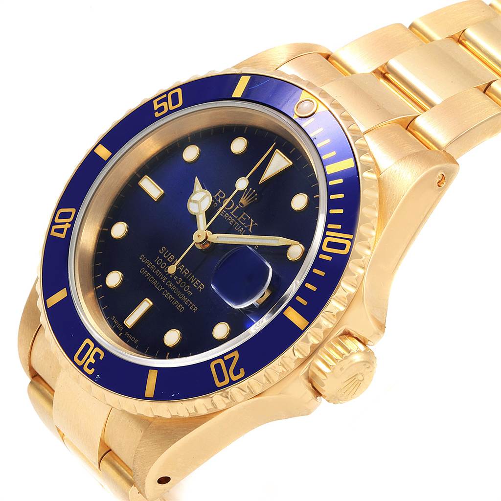 The image shows a close-up angle of a Rolex Submariner 16618 Men's Yellow Gold Blue Dial 16618 Men's Yellow Gold Blue Dial, featuring the dial, bezel, and part of the bracelet.