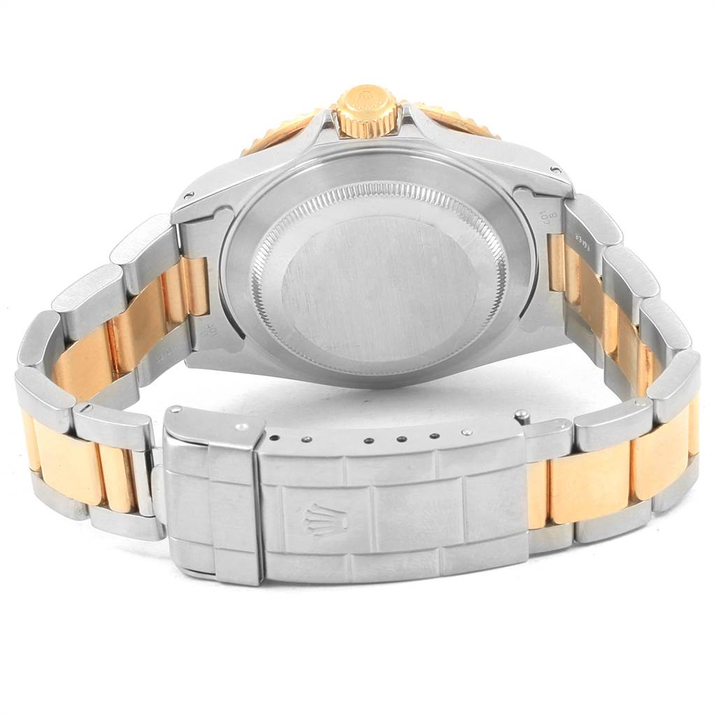 This image shows the back view of a Rolex Submariner 16613 Men's Steel and Gold (two tone) Blue Dial 16613 Men's Steel and Gold (two tone) Blue Dial watch, highlighting the case back, crown, and two-tone bracelet with clasp.