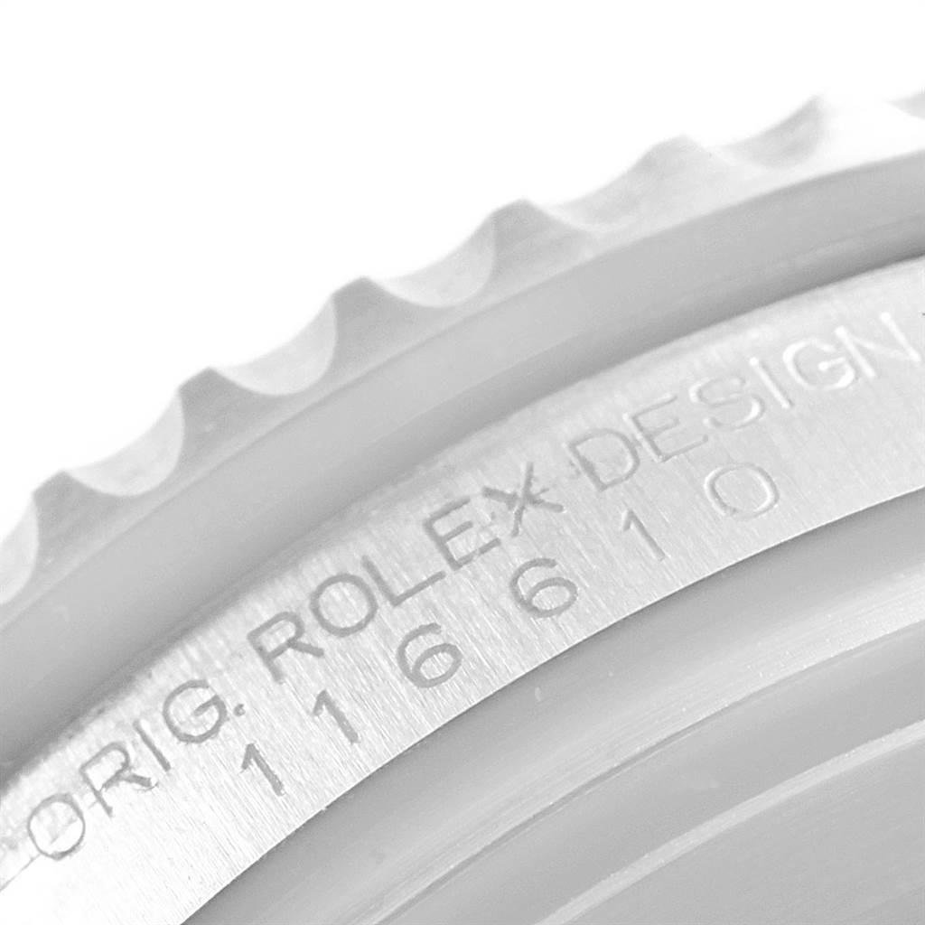 This is a close-up view of the bezel and outer casing of a Rolex Submariner 116610LV Men's Stainless Steel Green Dial 116610LV Men's Stainless Steel Green Dial watch, showing the model engravings.