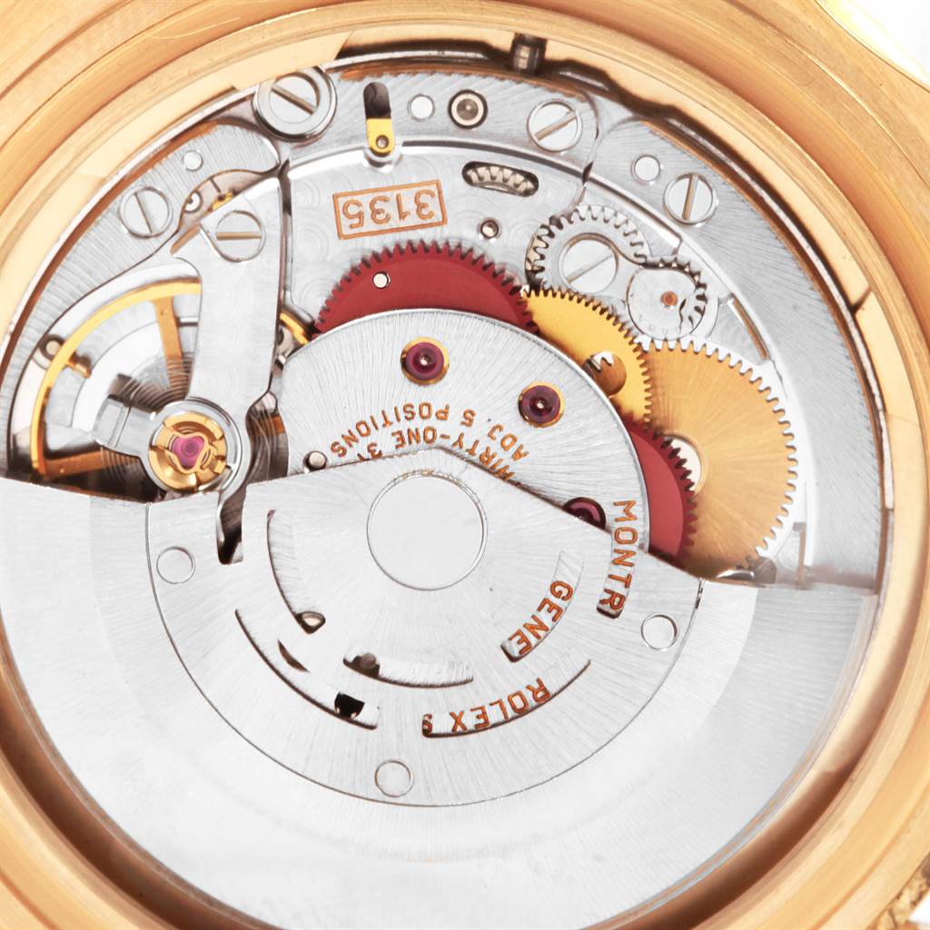 This image shows a close-up view of the movement and internal mechanics of a Rolex Submariner 16618 Men's Yellow Gold Black Dial 16618 Men's Yellow Gold Black Dial watch.