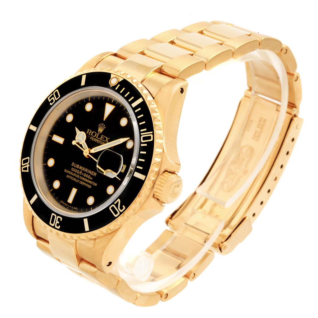 This image shows a Rolex Submariner 16618 Men's Yellow Gold Black Dial 16618 Men's Yellow Gold Black Dial from a three-quarter angle, highlighting its gold case, black dial, and partly open bracelet.