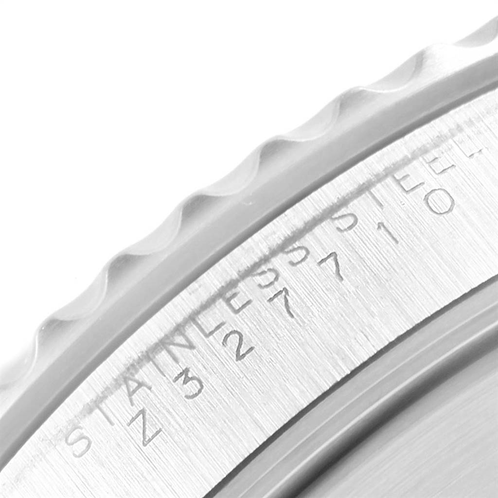 The image shows a close-up of the side of a Rolex Submariner 14060 Men's Stainless Steel Black Dial 14060 Men's Stainless Steel Black Dial watch, displaying part of the bezel and the engraved "STAINLESS STEEL" text.