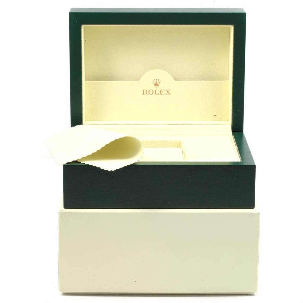 The image shows a Rolex watch box for a Submariner model, with the lid open and a cleaning cloth inside.