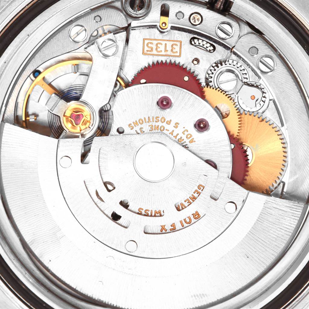 This image shows the intricate internal movement and mechanics of a Rolex Submariner 116610 Men's Stainless Steel Black Dial 116610 Men's Stainless Steel Black Dial watch from a close-up angle.