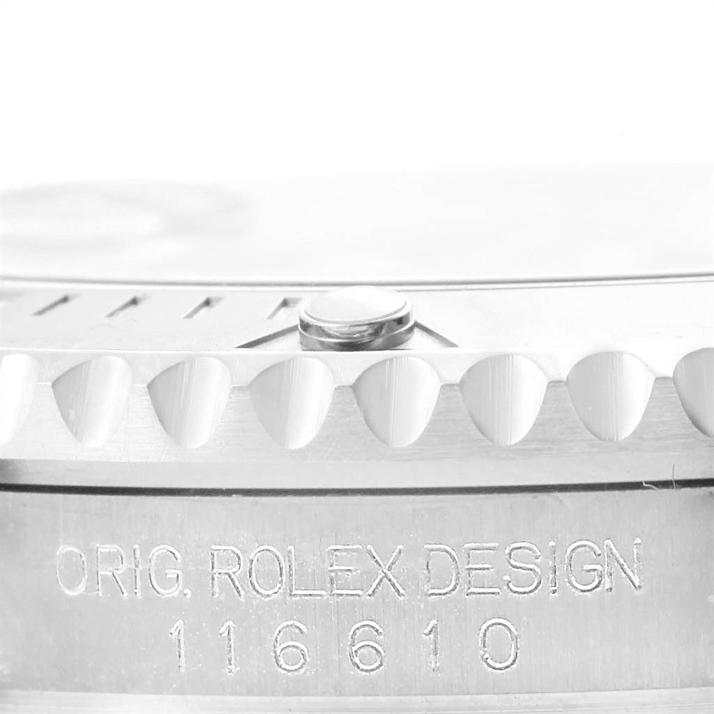 The image shows a close-up of the edge of a Rolex Submariner 116610 Men's Stainless Steel Black Dial 116610 Men's Stainless Steel Black Dial, including the bezel teeth and model number 116610 engraved on the side.
