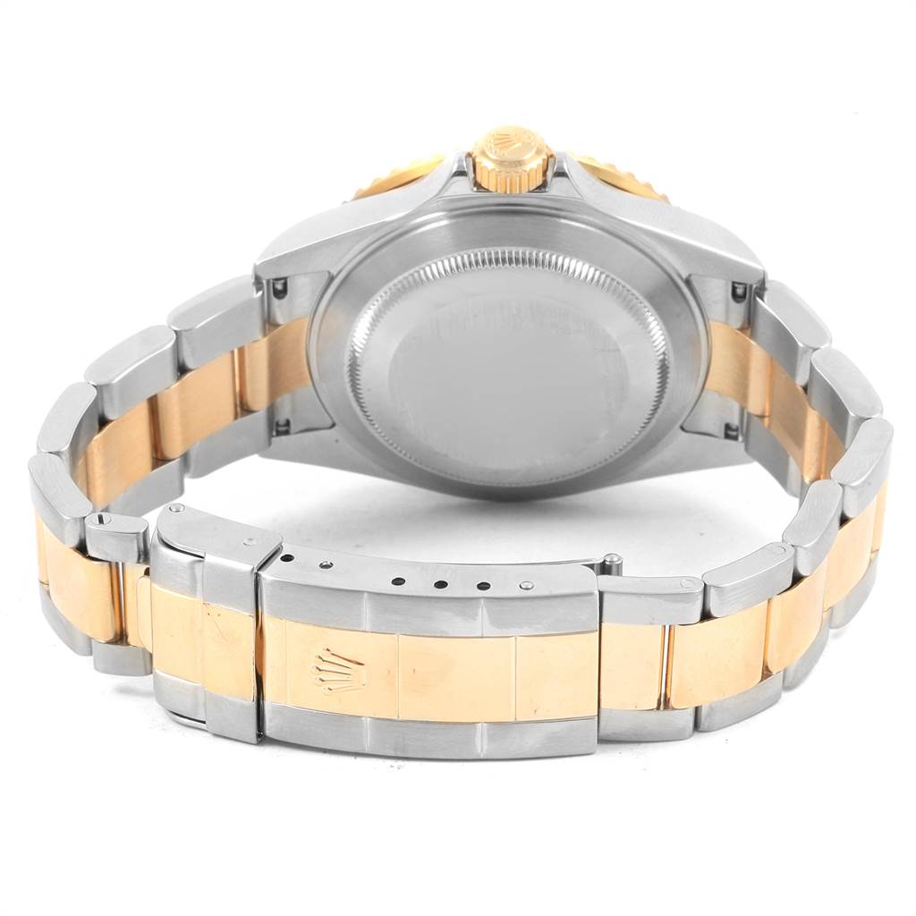 The image shows the back case and band of a Rolex Submariner 16613 Men's Steel and Gold (two tone) Black Dial 16613 Men's Steel and Gold (two tone) Black Dial, emphasizing the two-tone metal bracelet.