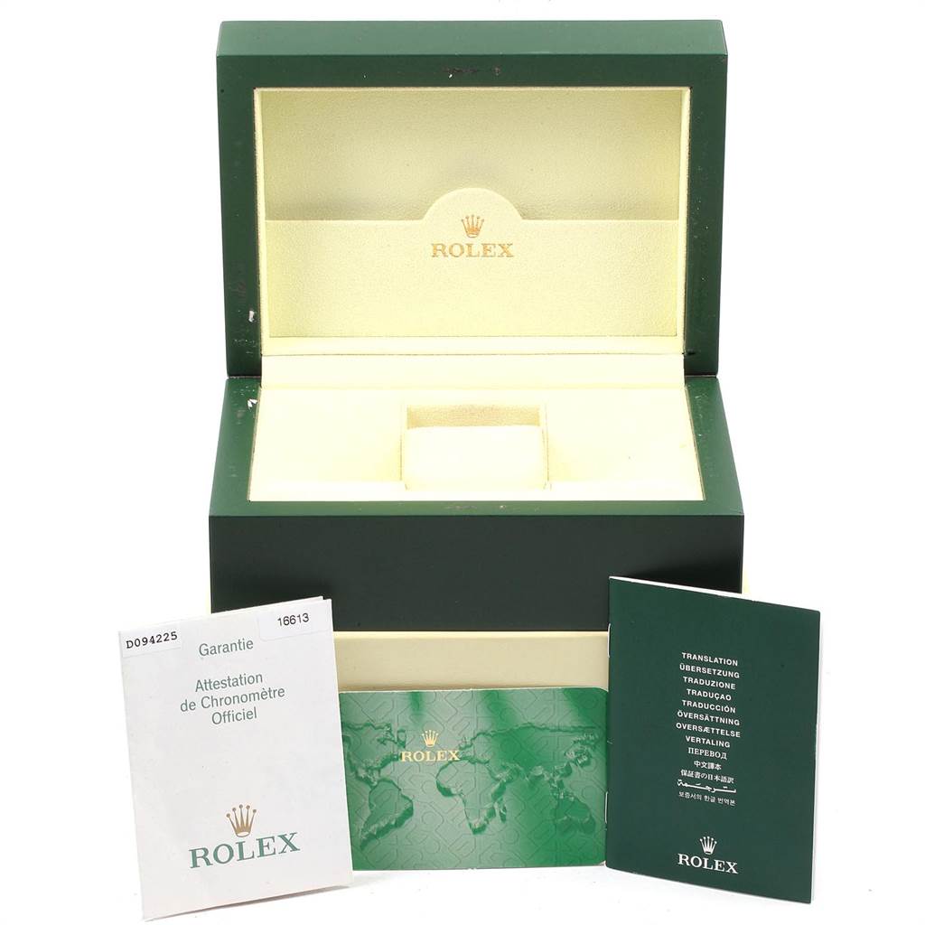 The image shows a green Rolex Submariner 16613 Men's Steel and Gold (two tone) Black Dial 16613 Men's Steel and Gold (two tone) Black Dial watch box and accompanying documentation from a front angle.