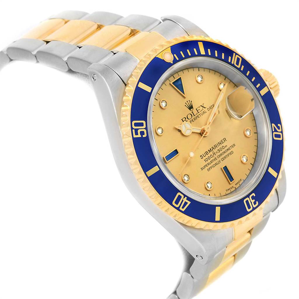 The image shows a Rolex Submariner 16613 Men's Steel and Gold (two tone) Champagne Dial 16613 Men's Steel and Gold (two tone) Champagne Dial watch from an angled view, highlighting the bezel, dial, and two-toned bracelet.