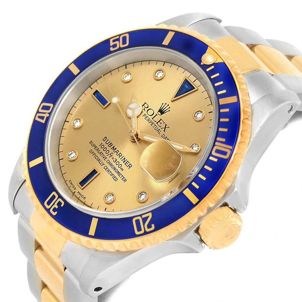 This image shows a close-up, angled view of a Rolex Submariner 16613 Men's Steel and Gold (two tone) Champagne Dial 16613 Men's Steel and Gold (two tone) Champagne Dial watch, highlighting the blue bezel, gold dial, crown, and part of the bracelet.