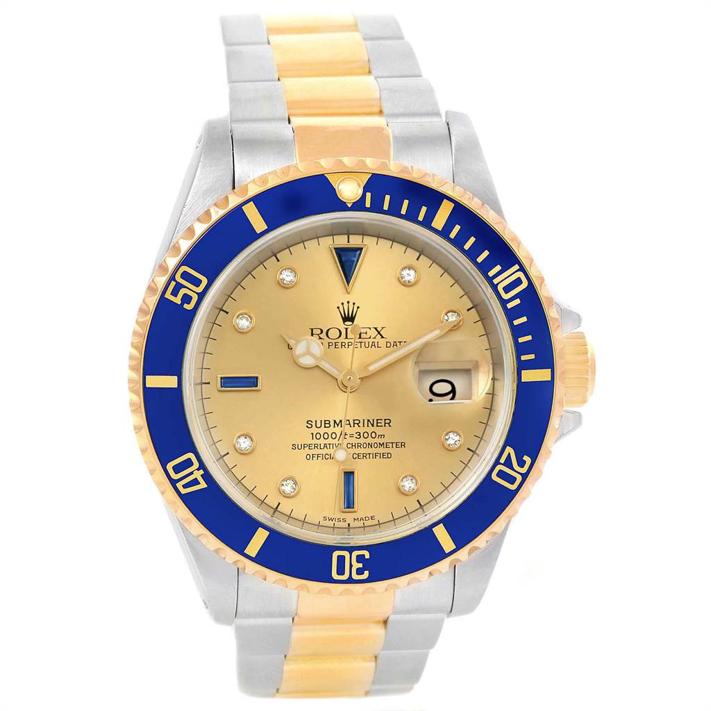 The Rolex Submariner 16613 Men's Steel and Gold (two tone) Champagne Dial 16613 Men's Steel and Gold (two tone) Champagne Dial watch is shown from the front, displaying its face, bezel, and part of the bracelet.