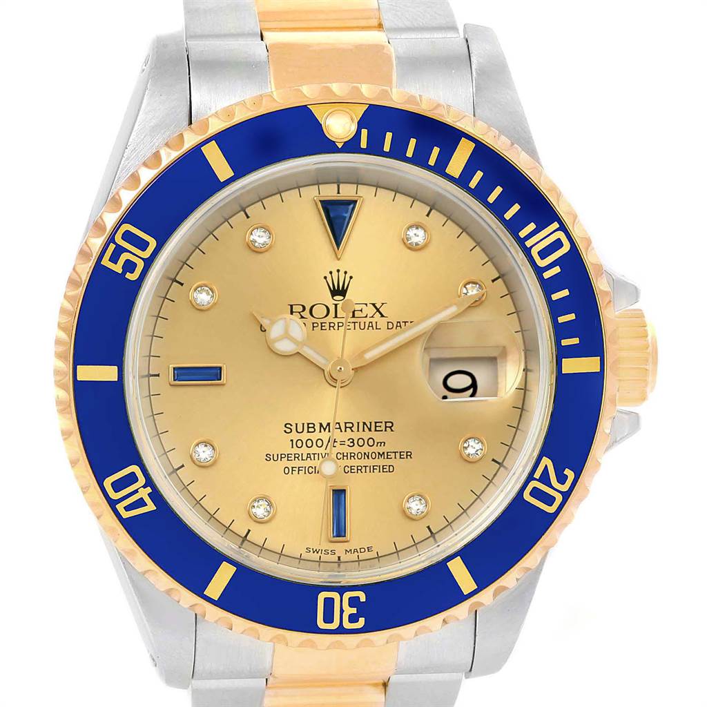 This image shows a front angle of a Rolex Submariner 16613 Men's Steel and Gold (two tone) Champagne Dial 16613 Men's Steel and Gold (two tone) Champagne Dial watch featuring the dial, bezel, date window, and part of the bracelet.