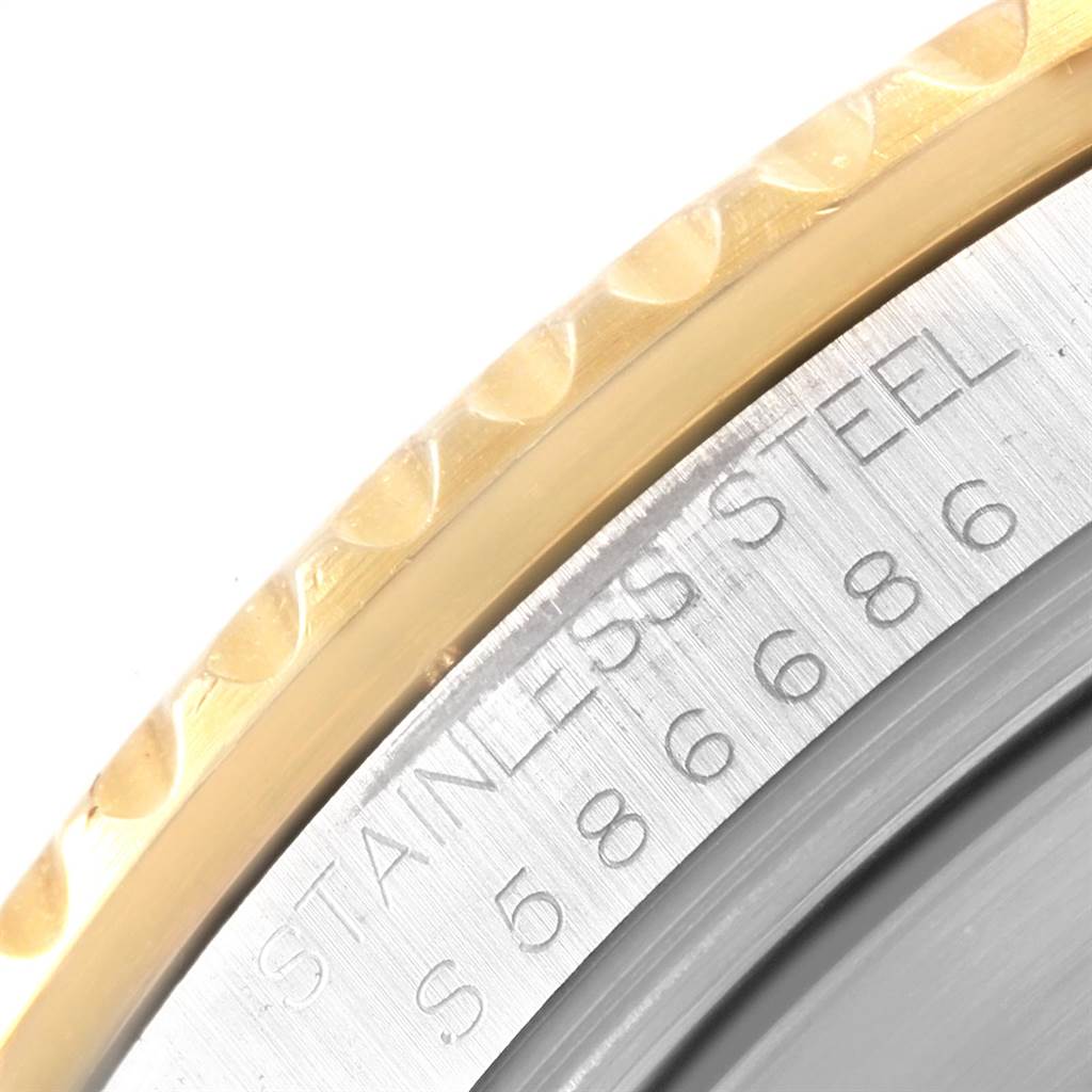 This image shows a close-up of the stainless steel and gold bezel engraving on a Rolex Submariner 16613 Men's Steel and Gold (two tone) Blue Dial 16613 Men's Steel and Gold (two tone) Blue Dial watch.