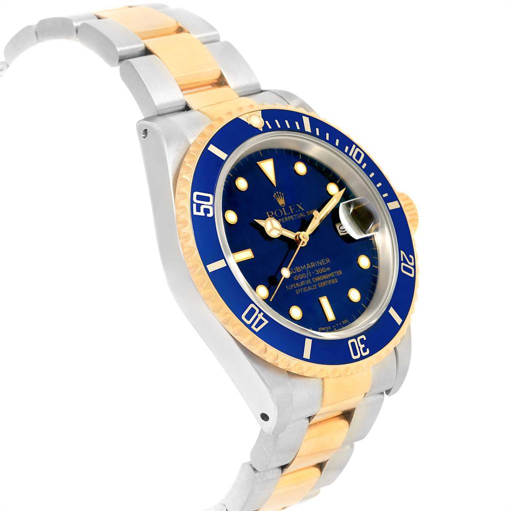The image shows a Rolex Submariner 16613 Men's Steel and Gold (two tone) Blue Dial 16613 Men's Steel and Gold (two tone) Blue Dial watch from an angled perspective, highlighting the bezel, dial, and two-tone bracelet.