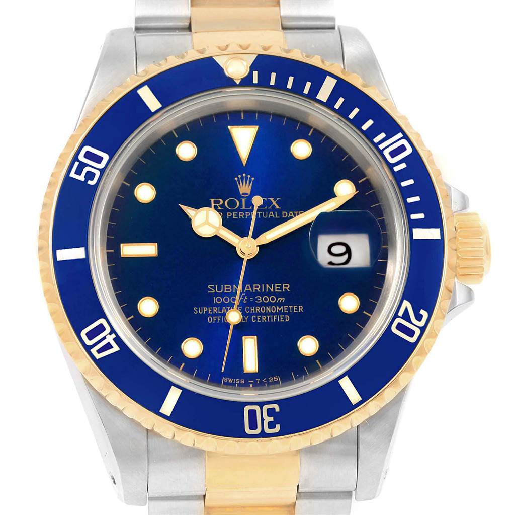 The image shows a frontal view of a Rolex Submariner 16613 Men's Steel and Gold (two tone) Blue Dial 16613 Men's Steel and Gold (two tone) Blue Dial watch, highlighting its blue dial, blue and gold bezel, and gold and silver bracelet.