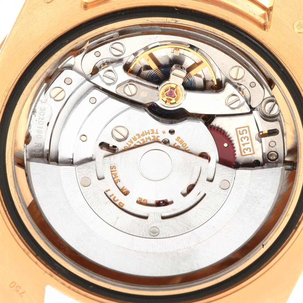 The image shows a close-up of the movement and internal mechanisms of a Rolex Submariner 116618 Men's Yellow Gold Blue Dial 116618 Men's Yellow Gold Blue Dial watch, captured from the back.