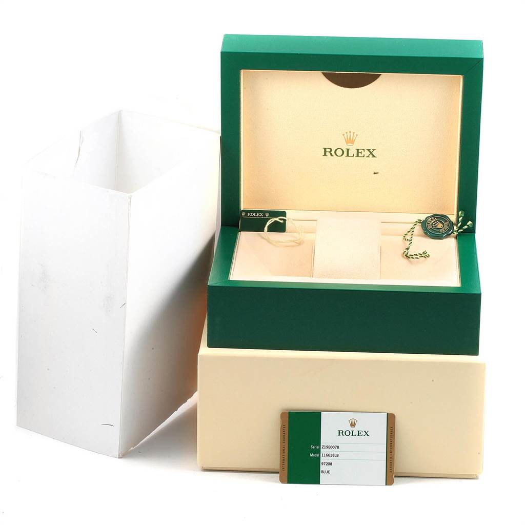 The image shows the packaging box, tag, and authenticity card for the Rolex Submariner 116618 Men's Yellow Gold Blue Dial 116618 Men's Yellow Gold Blue Dial.