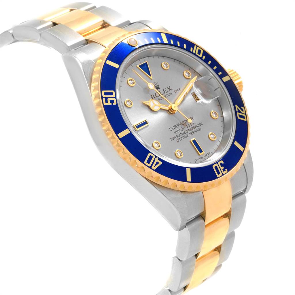 The image shows a side angle of the Rolex Submariner 16613 Men's Steel and Gold (two tone) Grey Dial 16613 Men's Steel and Gold (two tone) Grey Dial watch, highlighting its bezel, dial, crown, and two-tone bracelet.