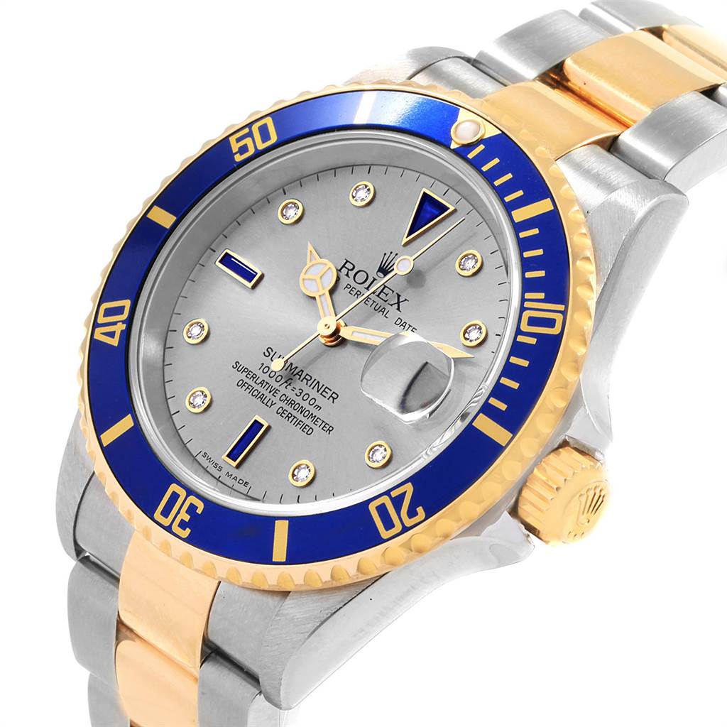 The Rolex Submariner 16613 Men's Steel and Gold (two tone) Grey Dial 16613 Men's Steel and Gold (two tone) Grey Dial watch is shown at a slight side angle, displaying its bezel, dial, bracelet, and crown.